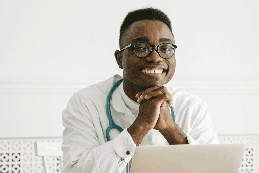 African female school psychologist supporting sad teenage girl during her difficult situation at school